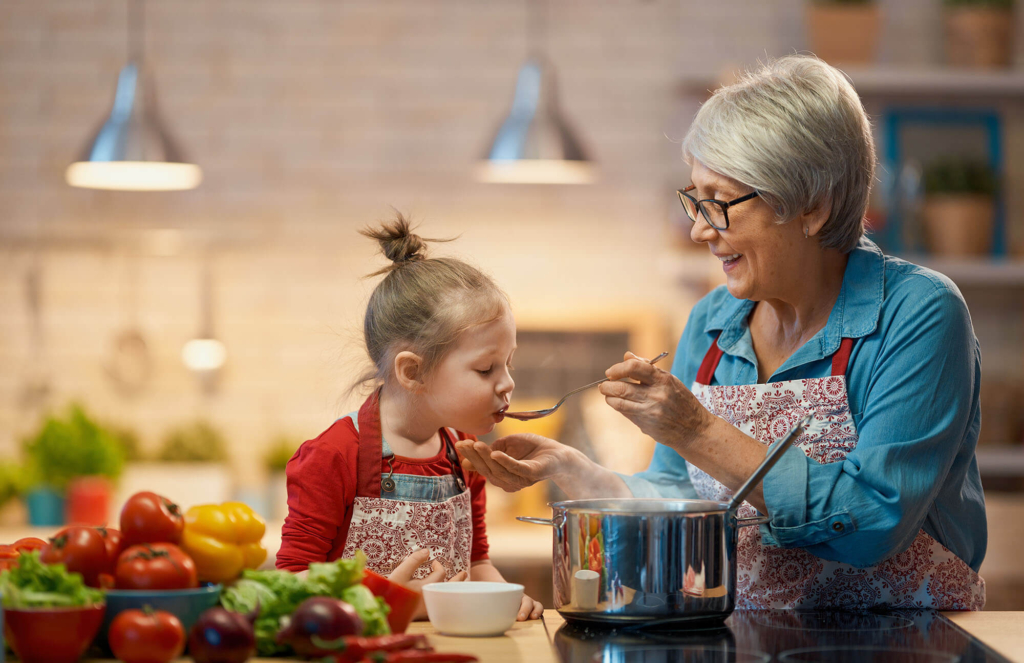 adult and child cooking together